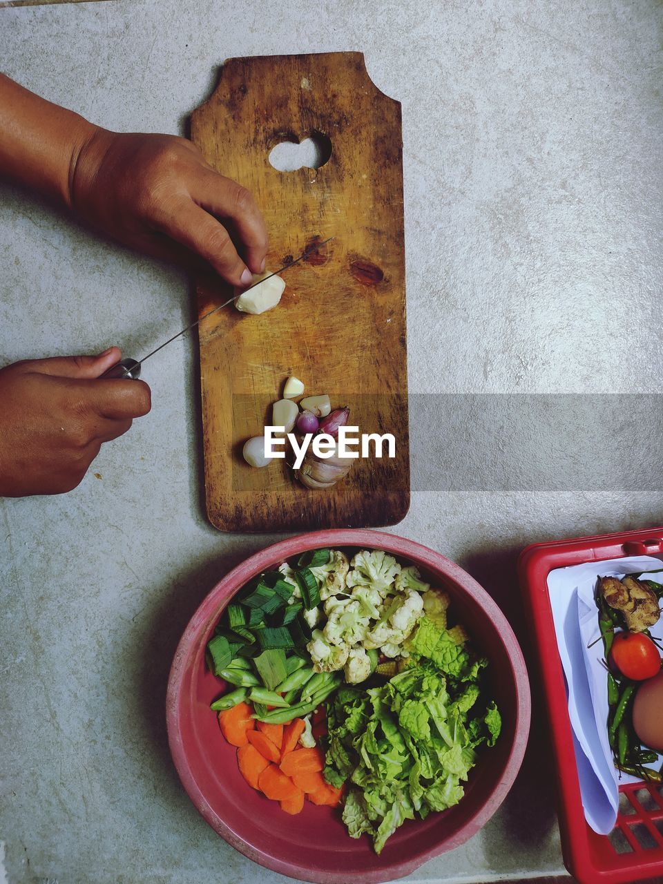 High angle view of person preparing food on cutting board