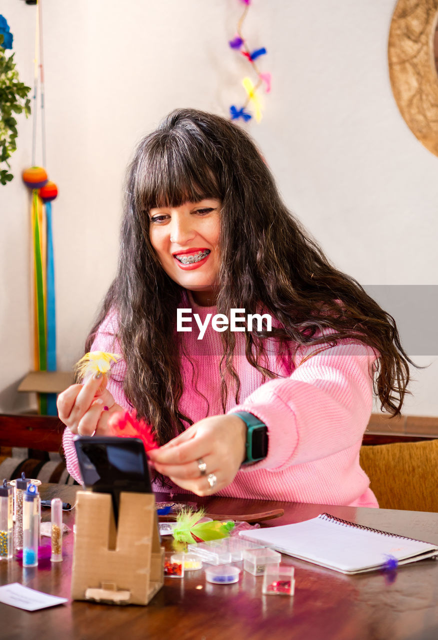 high angle view of girl playing with toys on table at home