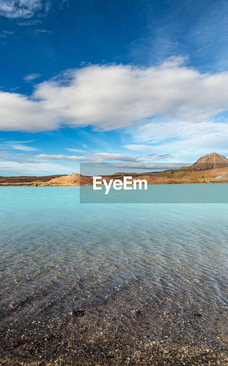 SCENIC VIEW OF BAY AGAINST SKY