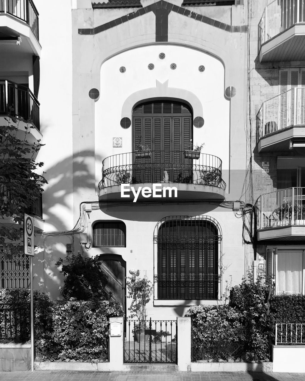 architecture, building exterior, built structure, black and white, building, house, street, road, monochrome photography, monochrome, city, day, no people, residential district, white, nature, plant, facade, entrance, arch, outdoors, black, urban area, window, tree