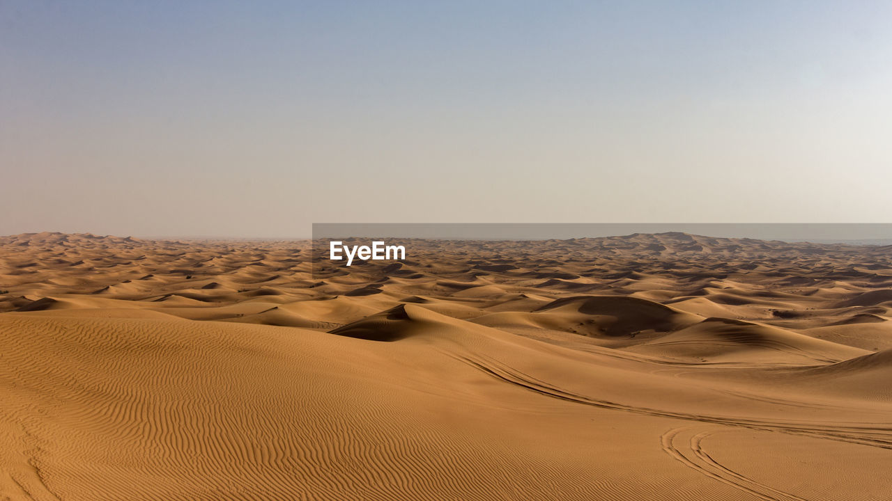 Scenic view of desert against clear sky