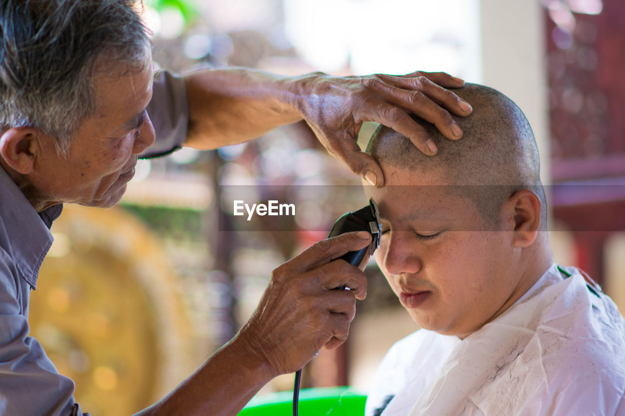 Barber with young man