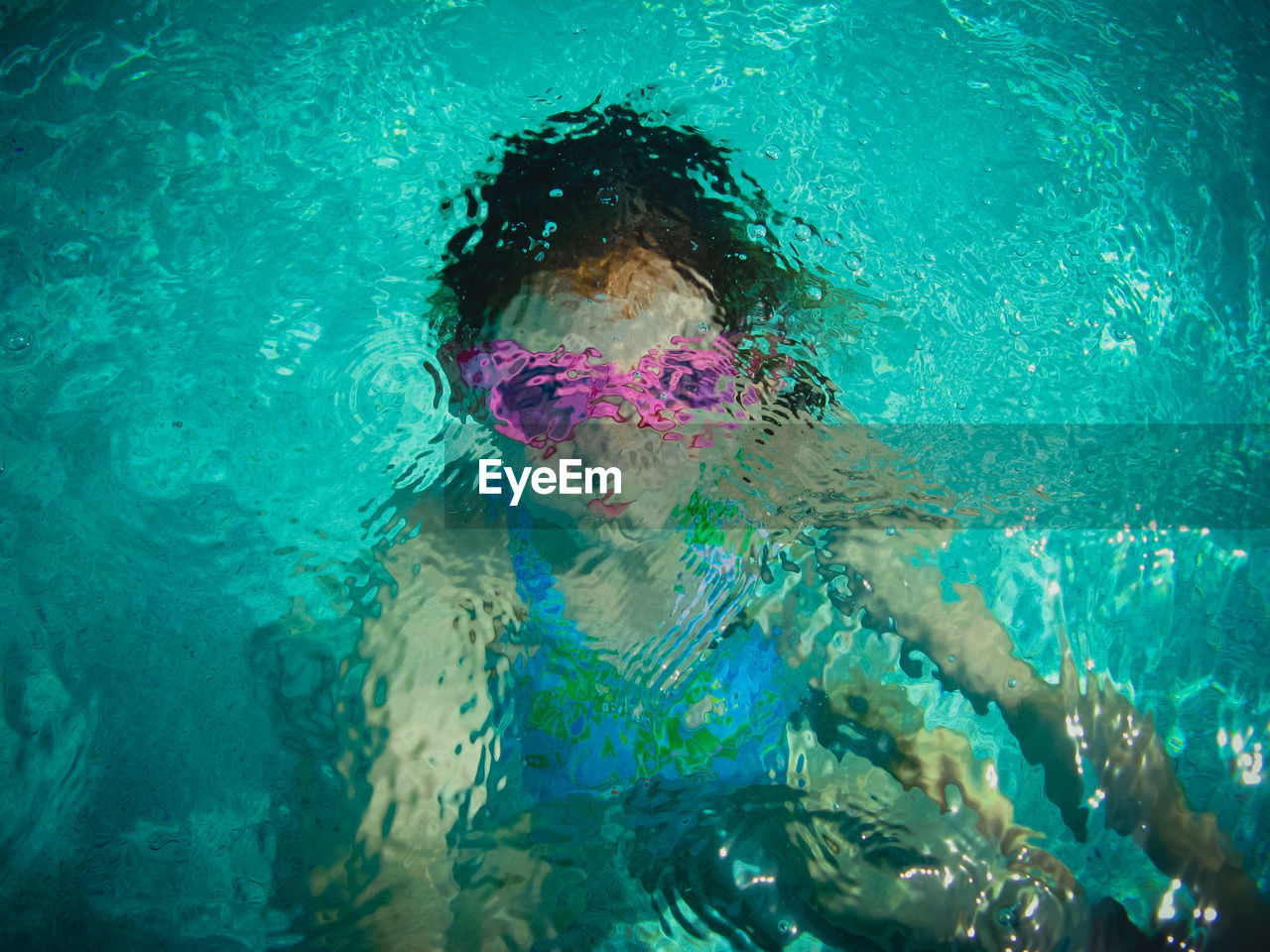 Girl swimming in pool