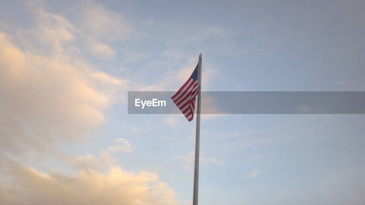 Low angle view of flag against sky