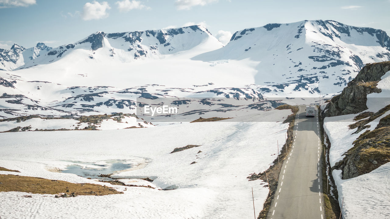 scenic view of snow covered mountains against sky