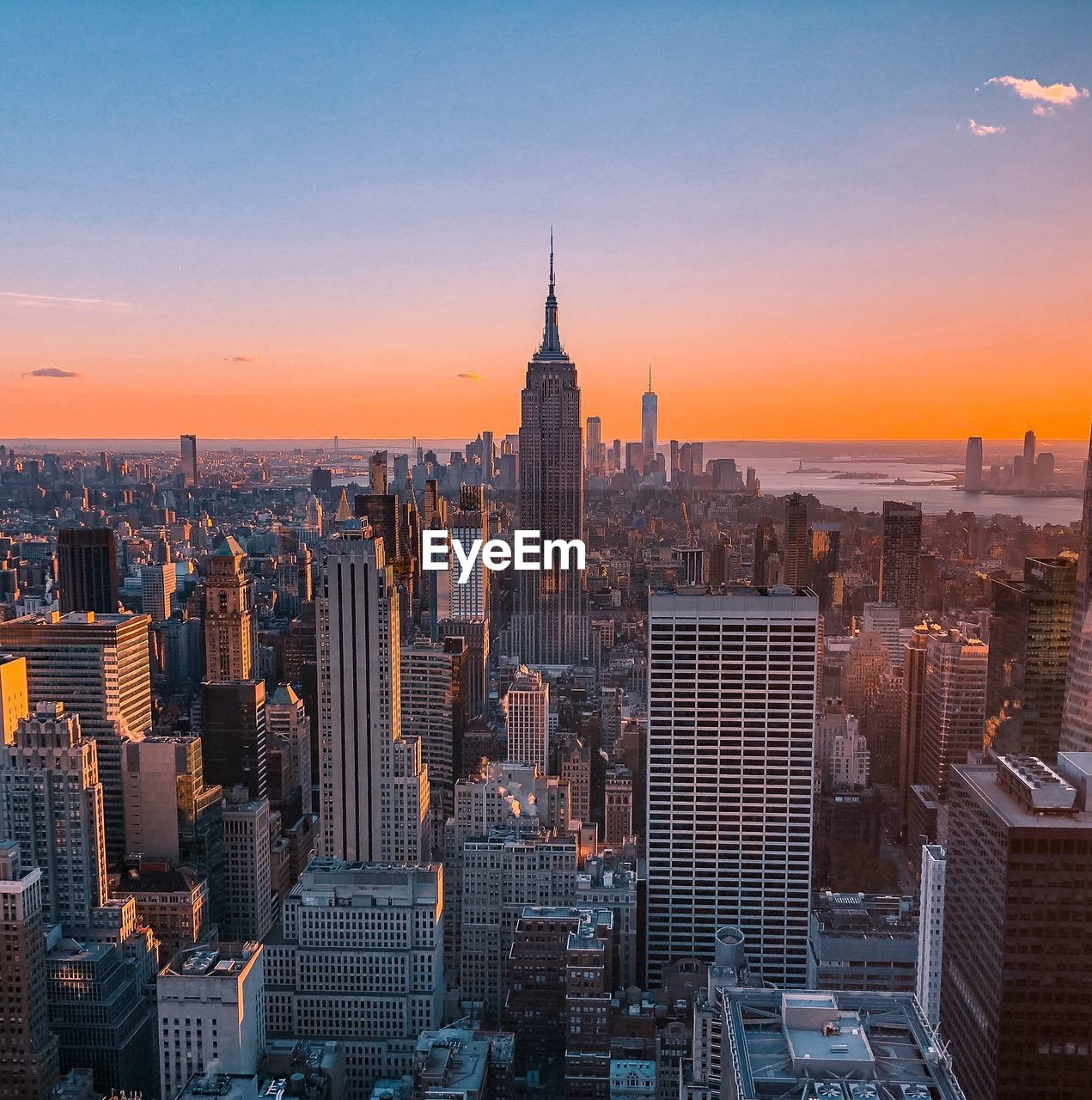 Aerial view of buildings in manhattan during sunset