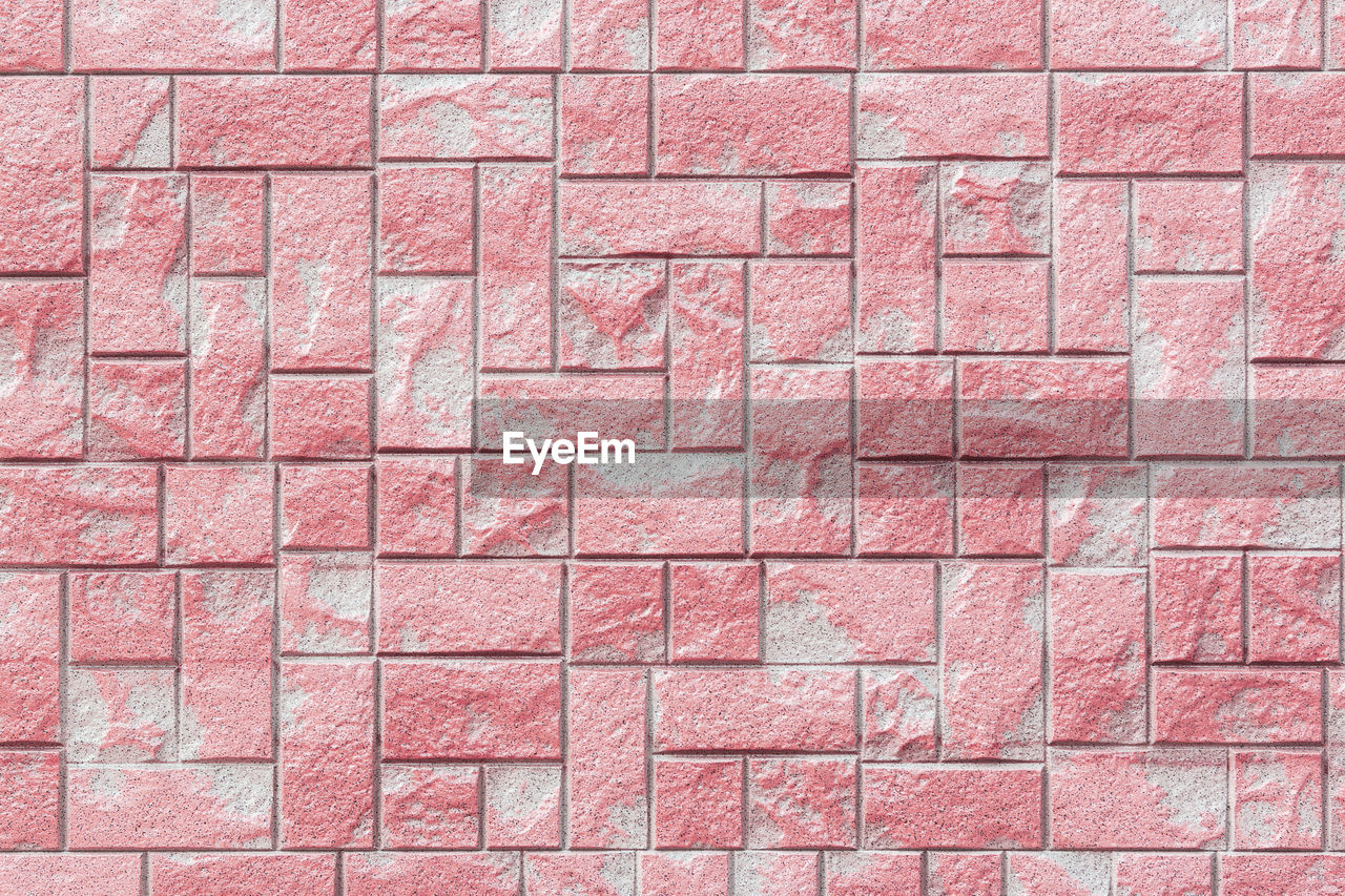 FULL FRAME SHOT OF BRICK WALL WITH RED WALLS
