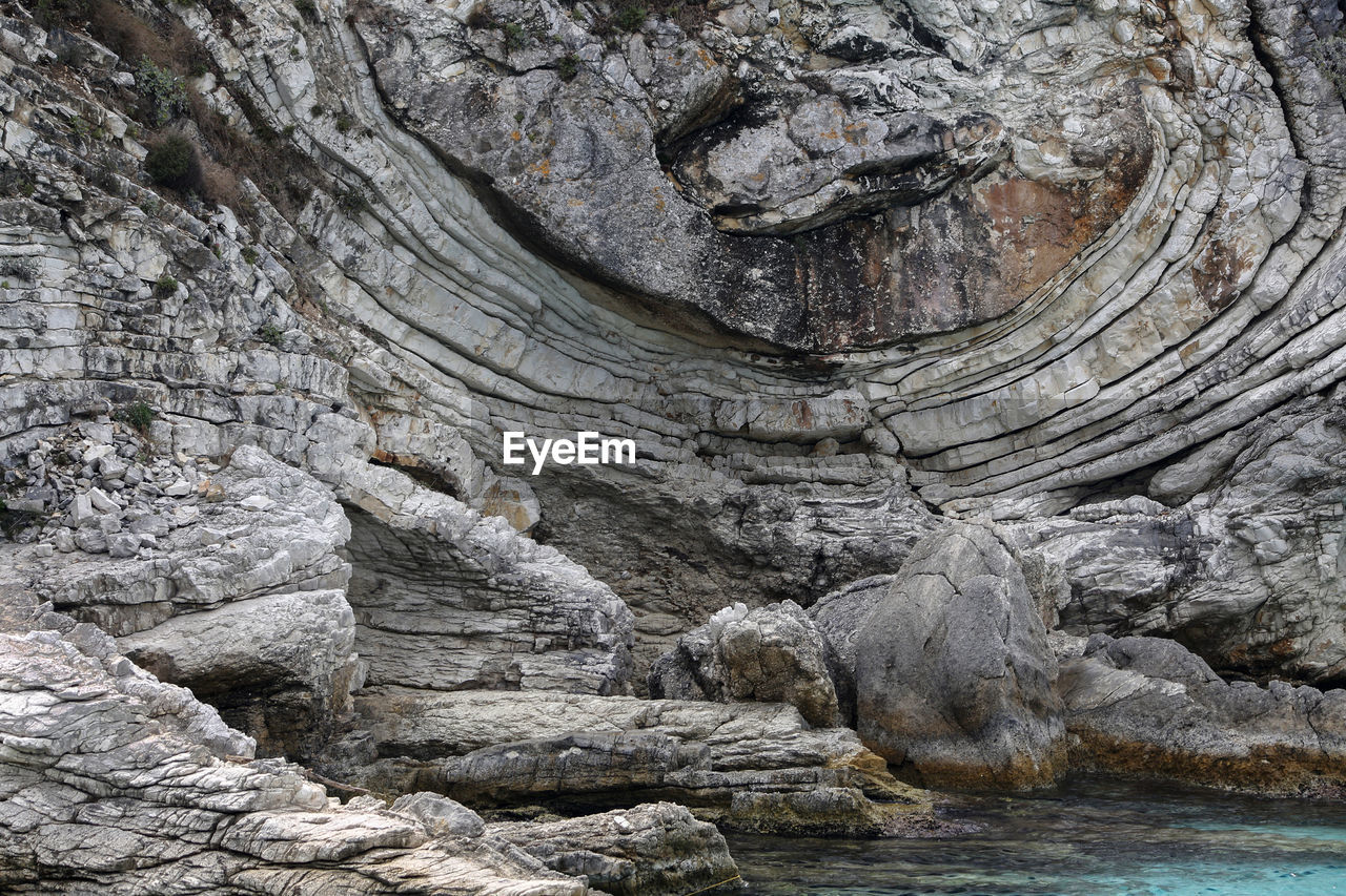 The bizarre lines of rock sculptured by nature in the ionian sea, greece