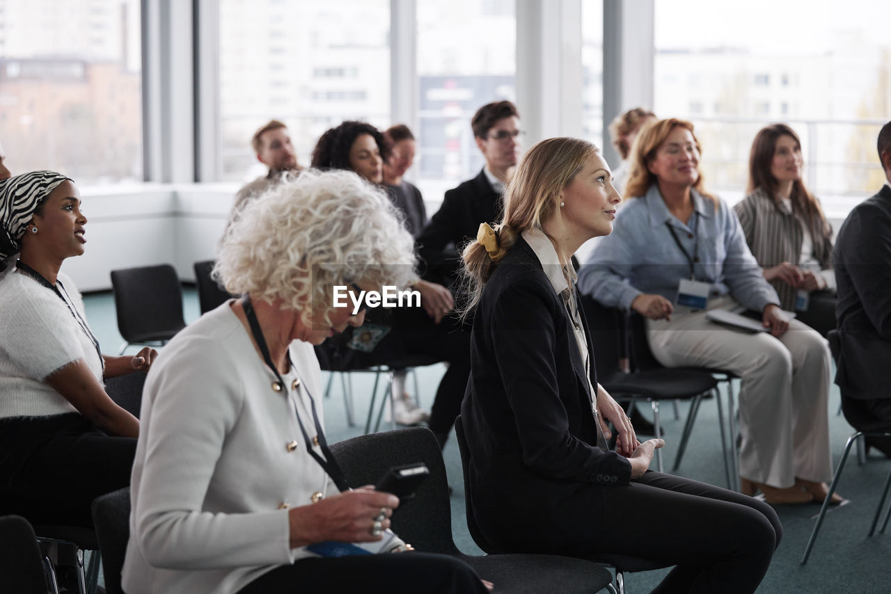 Business people sitting during business meeting