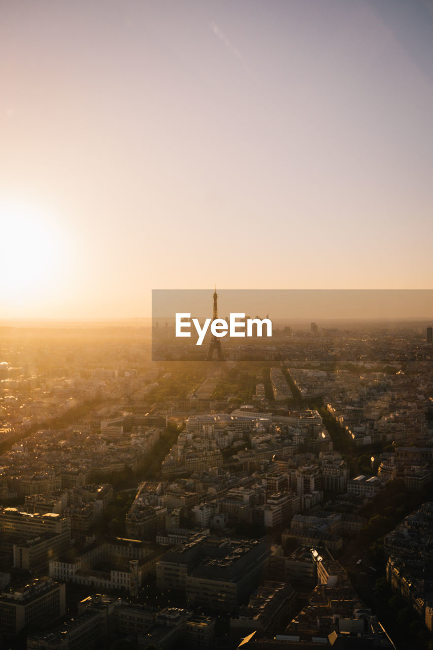 High angle view of city buildings during sunset