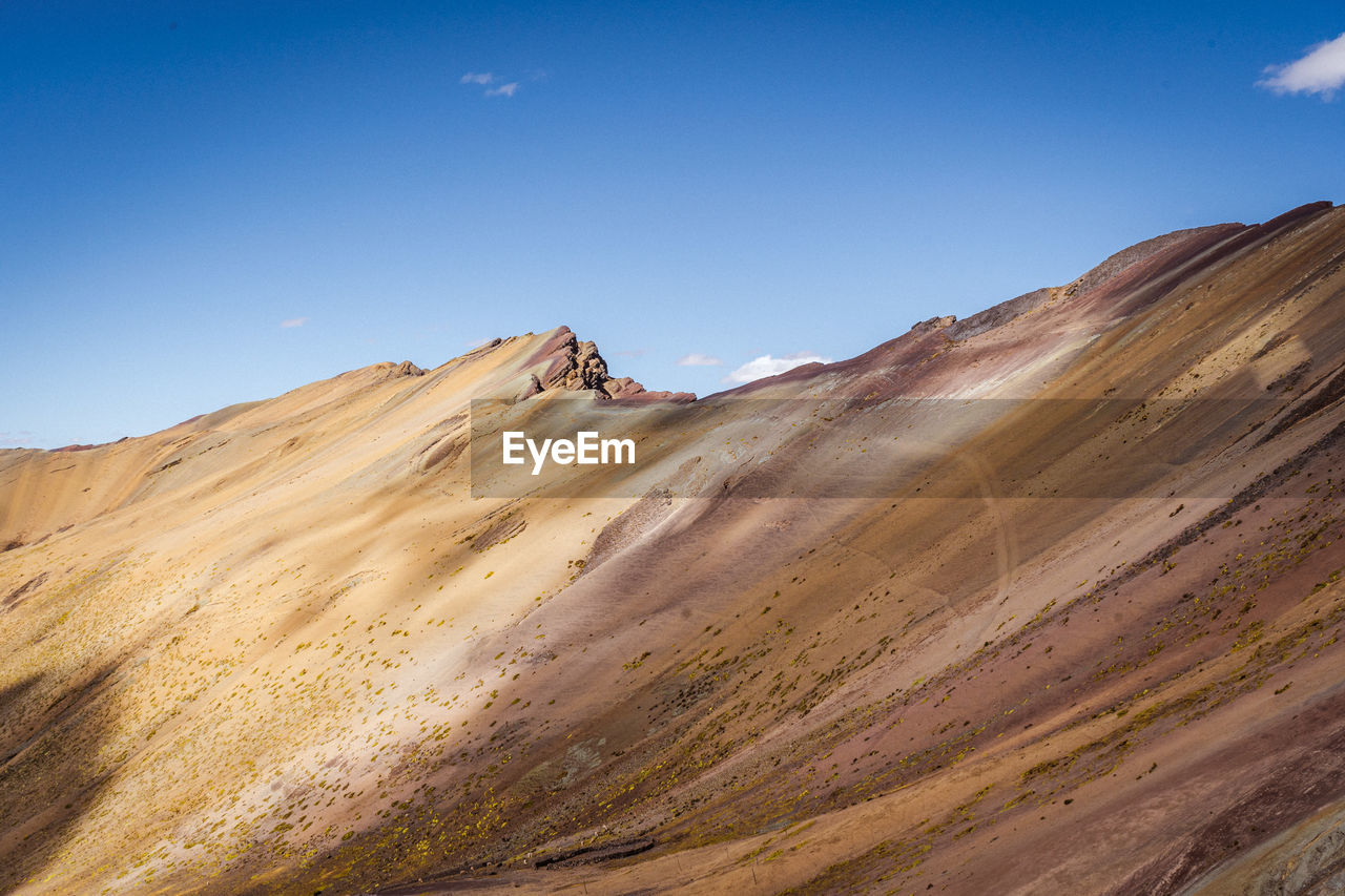 Panoramic view of rocky mountains against sky