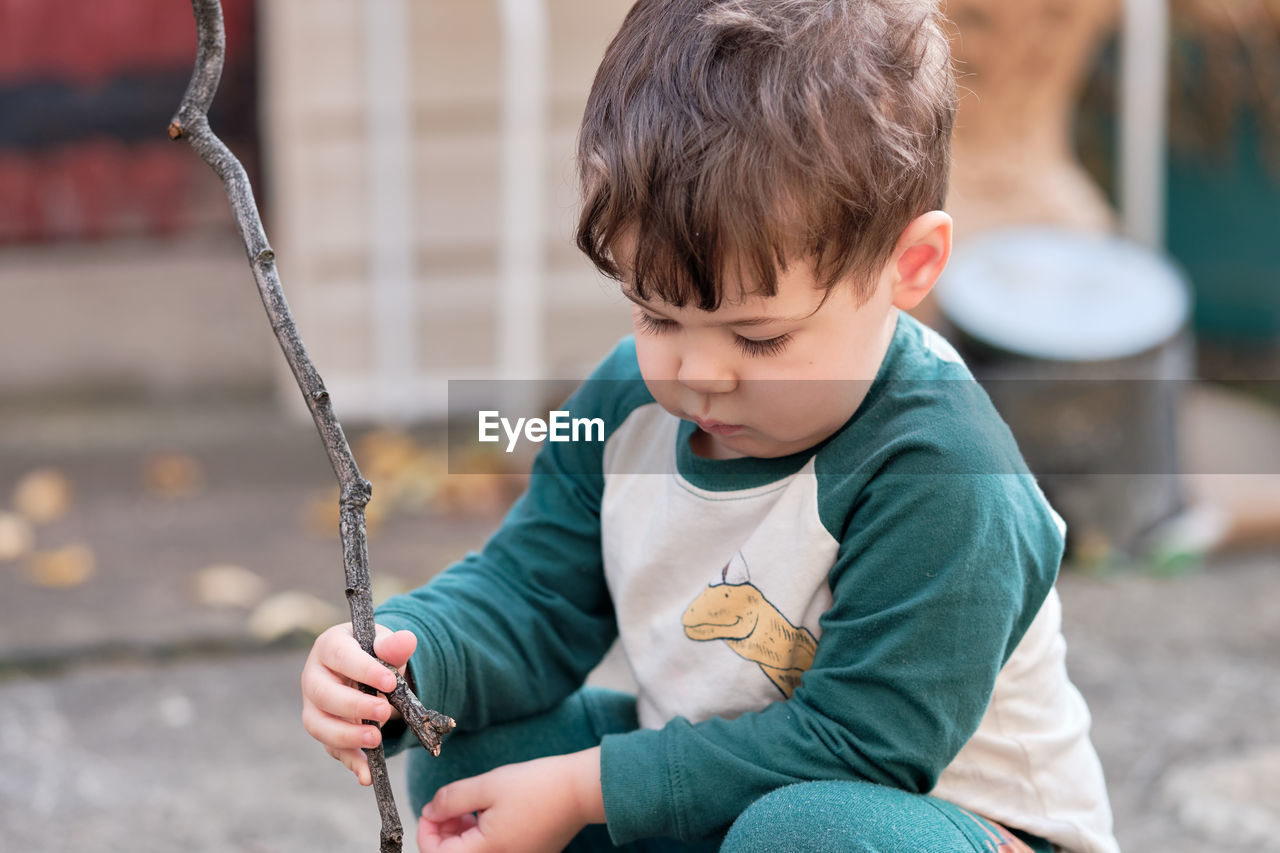 Cute little boy playing in the backyard