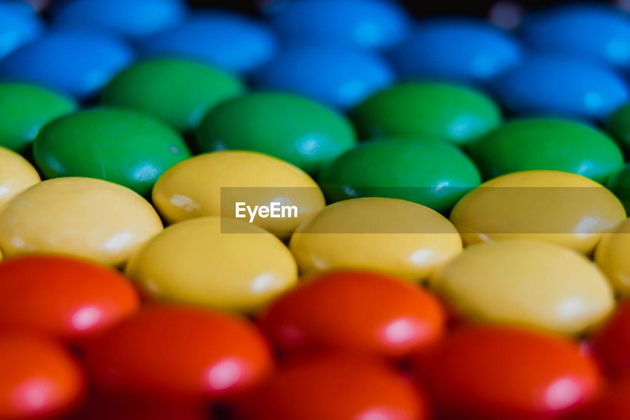 Full frame shot of multi colored candies. rainbow of multicolored sweet dragees 