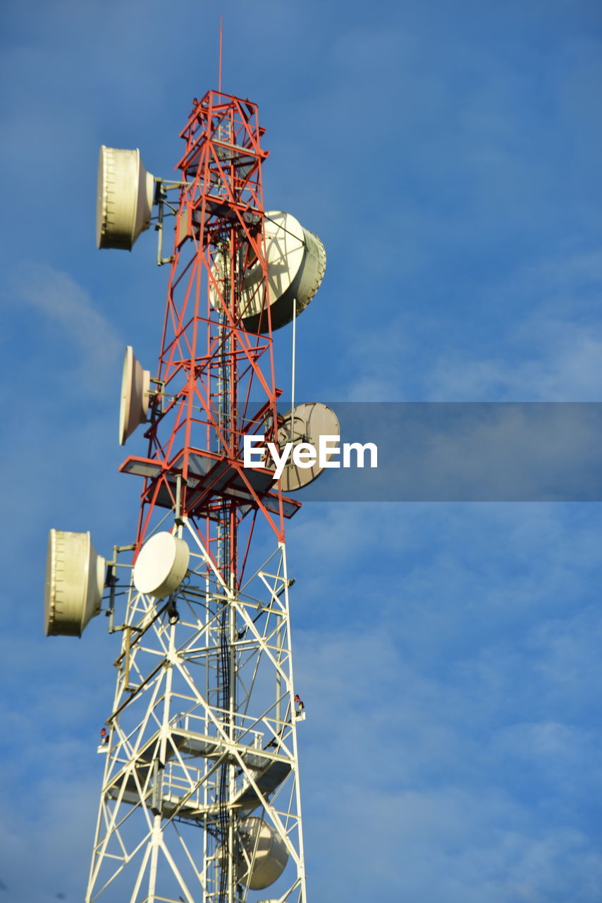 global communications, sky, technology, communication, wireless technology, satellite, blue, telecommunications engineering, satellite dish, broadcasting, computer network, telecommunications equipment, internet, communications tower, antenna, low angle view, cloud, no people, nature, vehicle, global business, architecture, business, equipment, electricity, outdoors, corporate business, built structure, television industry