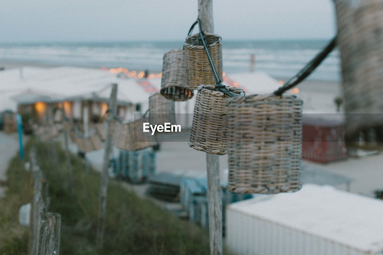 water, sea, hanging, nature, focus on foreground, basket, day, land, no people, beach, outdoors, sky, architecture, selective focus, travel destinations, travel