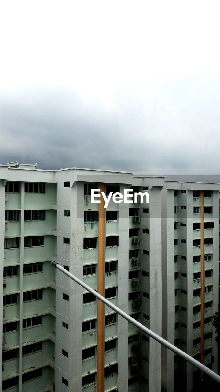 High angle view of building against cloudy sky