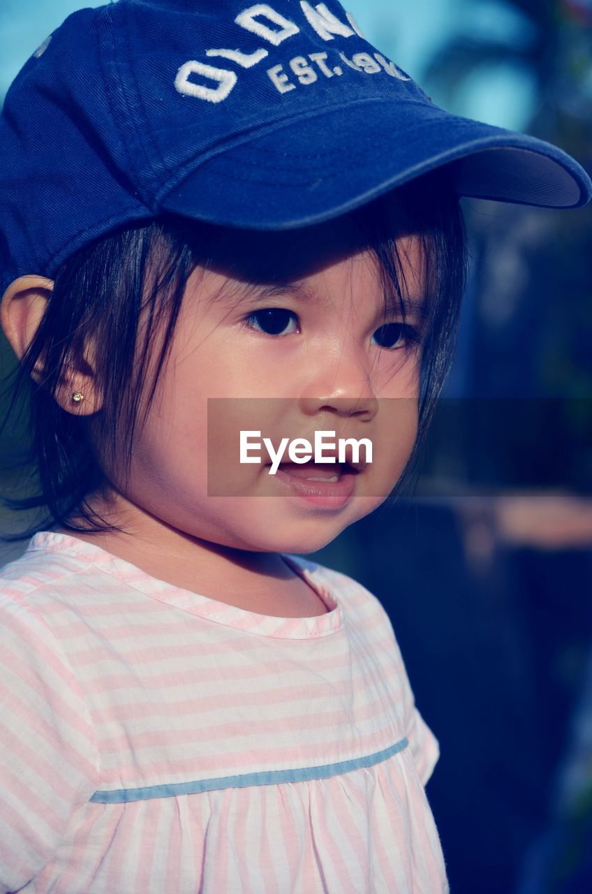 Portrait of a baby girl wearing hat