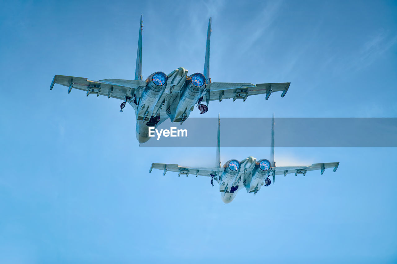 Squadron of sukhoi su30 mk2 just taking off and retract the landing gear