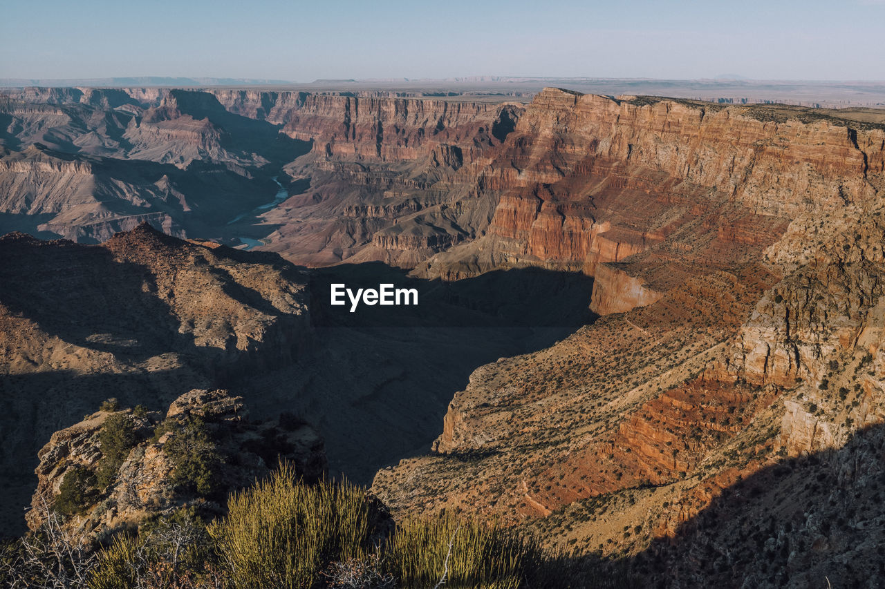 Aerial view of landscape with mountain range in background