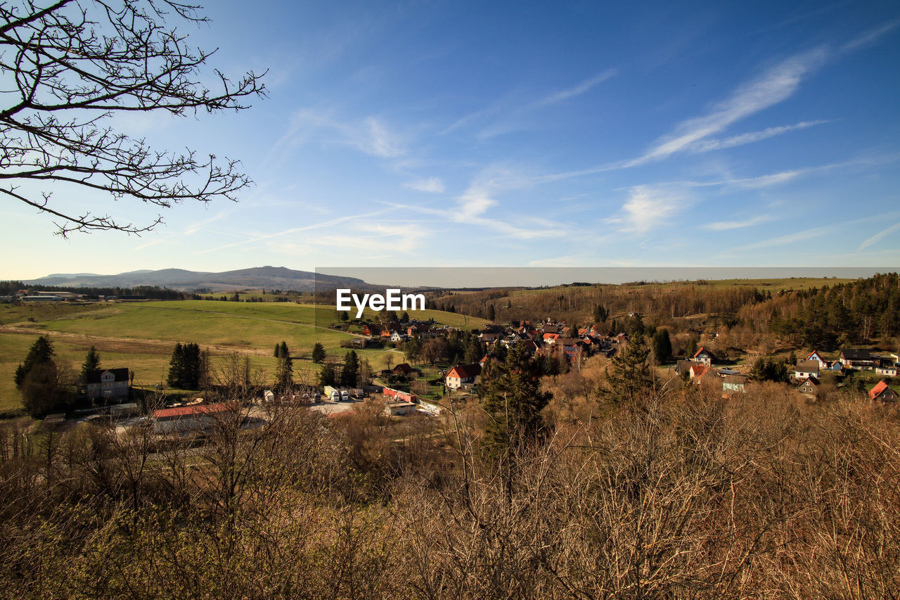 sky, landscape, environment, plant, rural area, nature, hill, tree, land, scenics - nature, morning, field, autumn, grass, rural scene, architecture, agriculture, cloud, beauty in nature, building, no people, outdoors, wilderness, house, tranquility, building exterior, day, non-urban scene, built structure, village, tranquil scene, natural environment, residential district