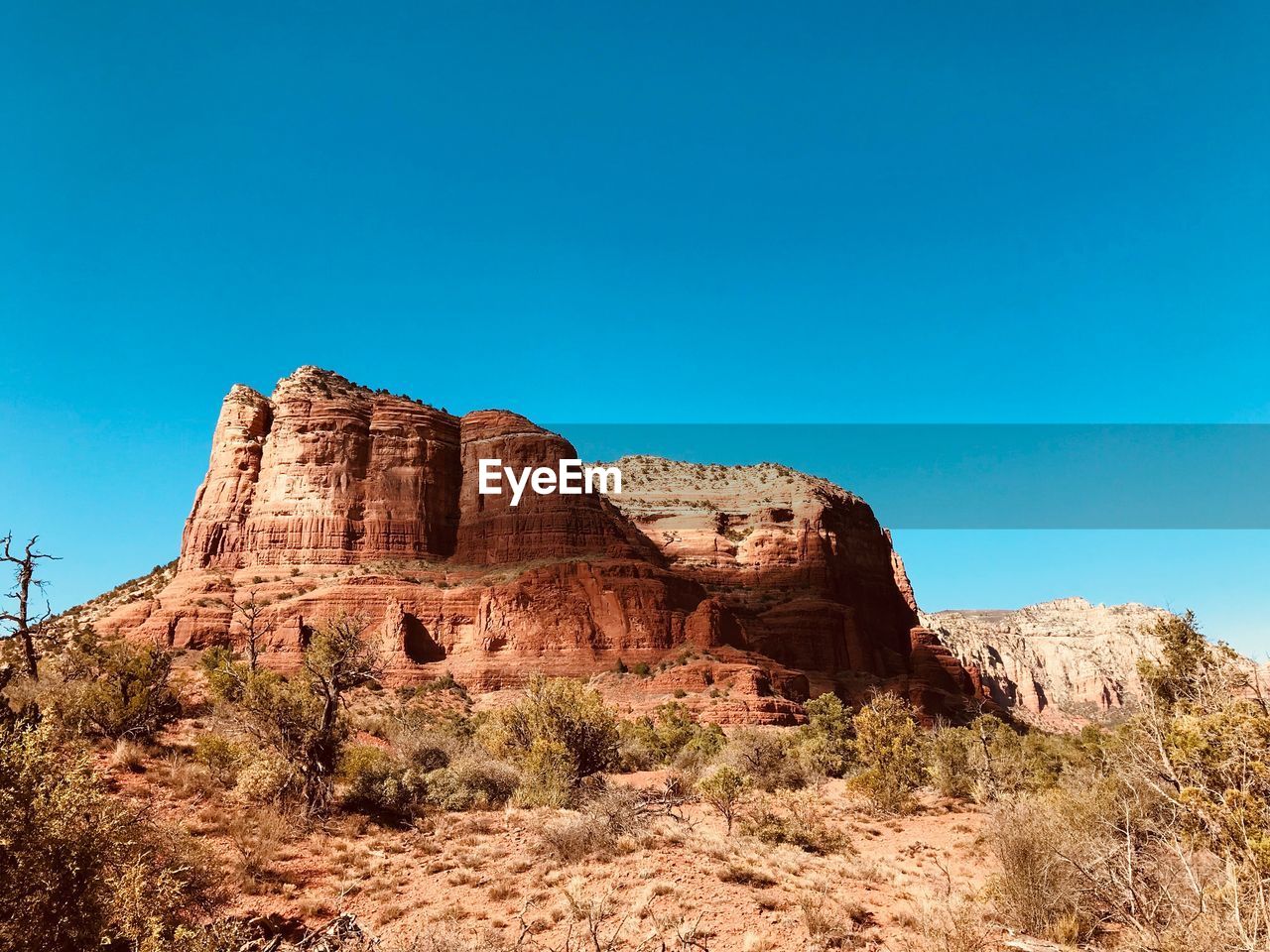 Rock formations on landscape against clear sky