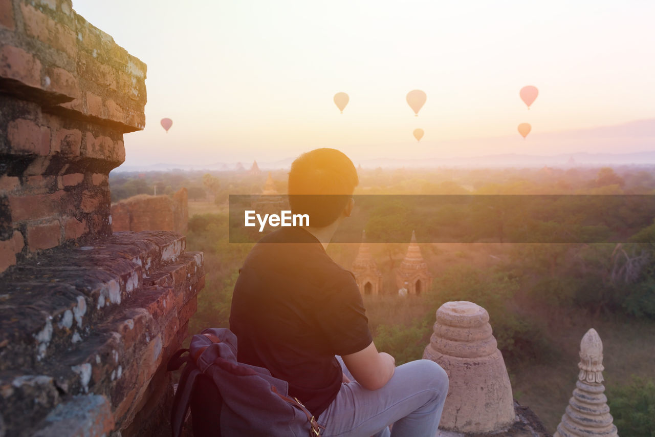 Tourist looking at hot air balloons