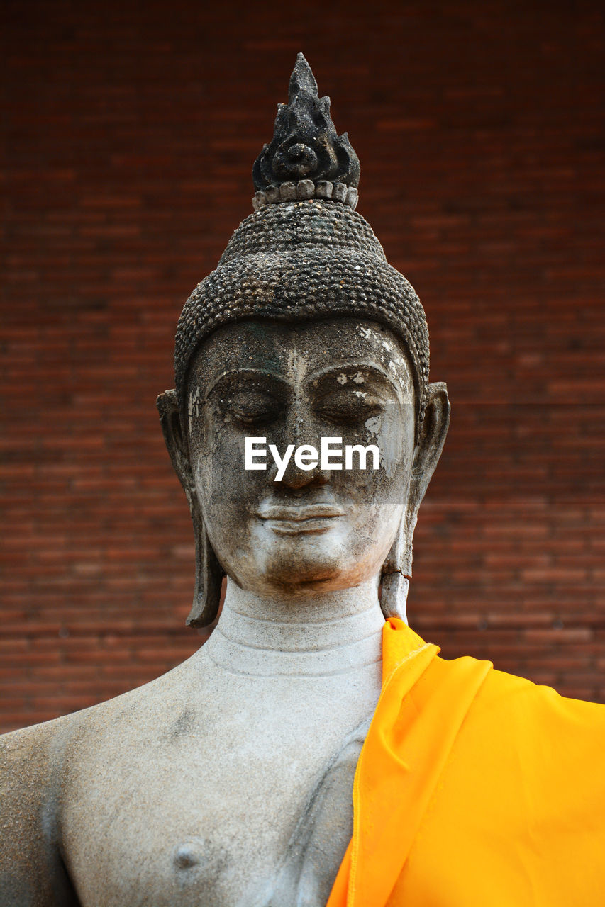 Ancient sculpture of a buddha head in the ayutthaya period