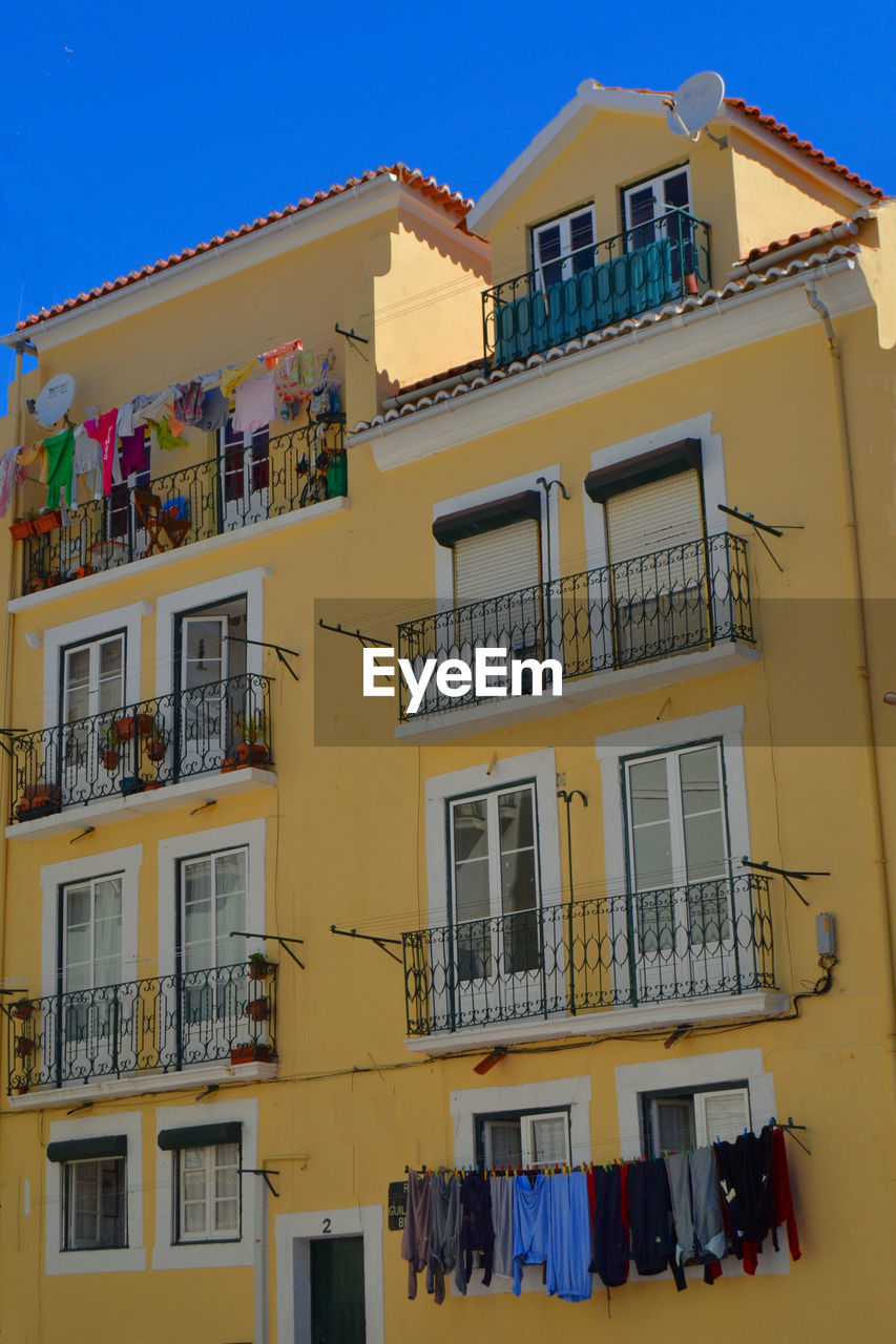 Low angle view of residential building against sky