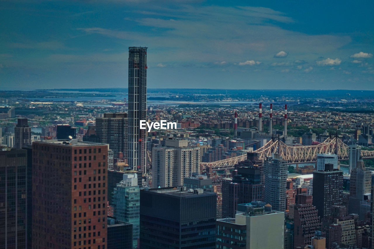 AERIAL VIEW OF BUILDINGS AGAINST SKY