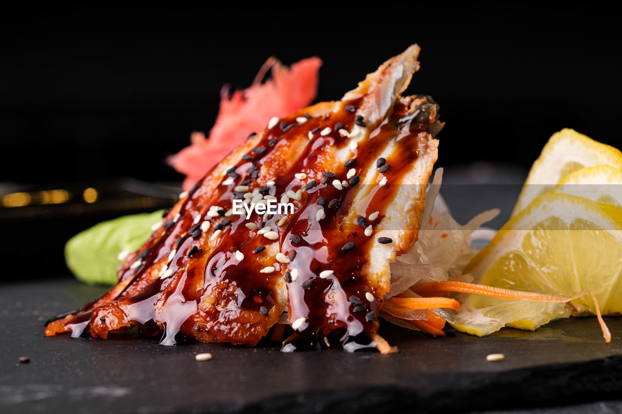 CLOSE-UP OF MEAT ON BARBECUE