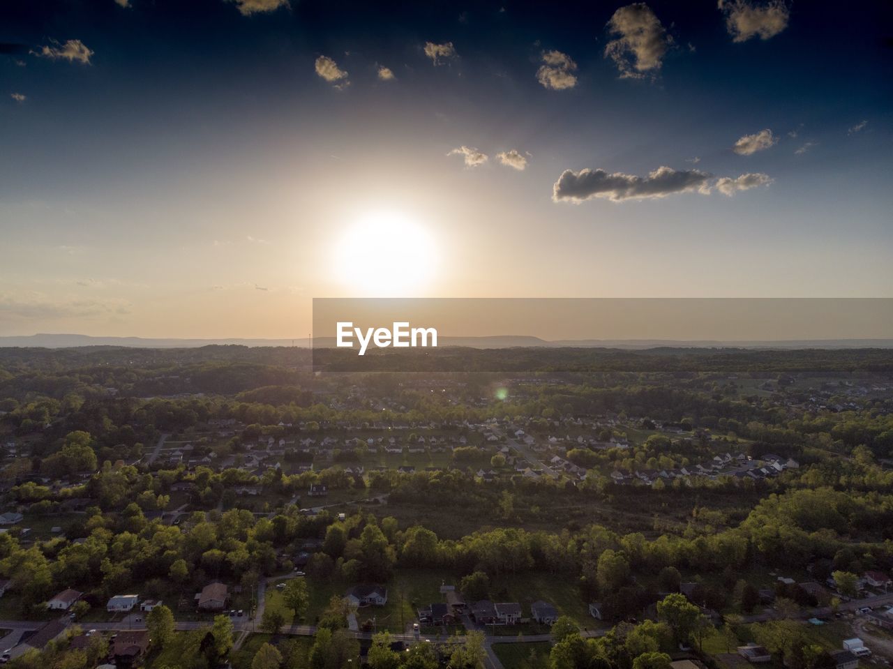 Aerial view of townscape against sky during sunset