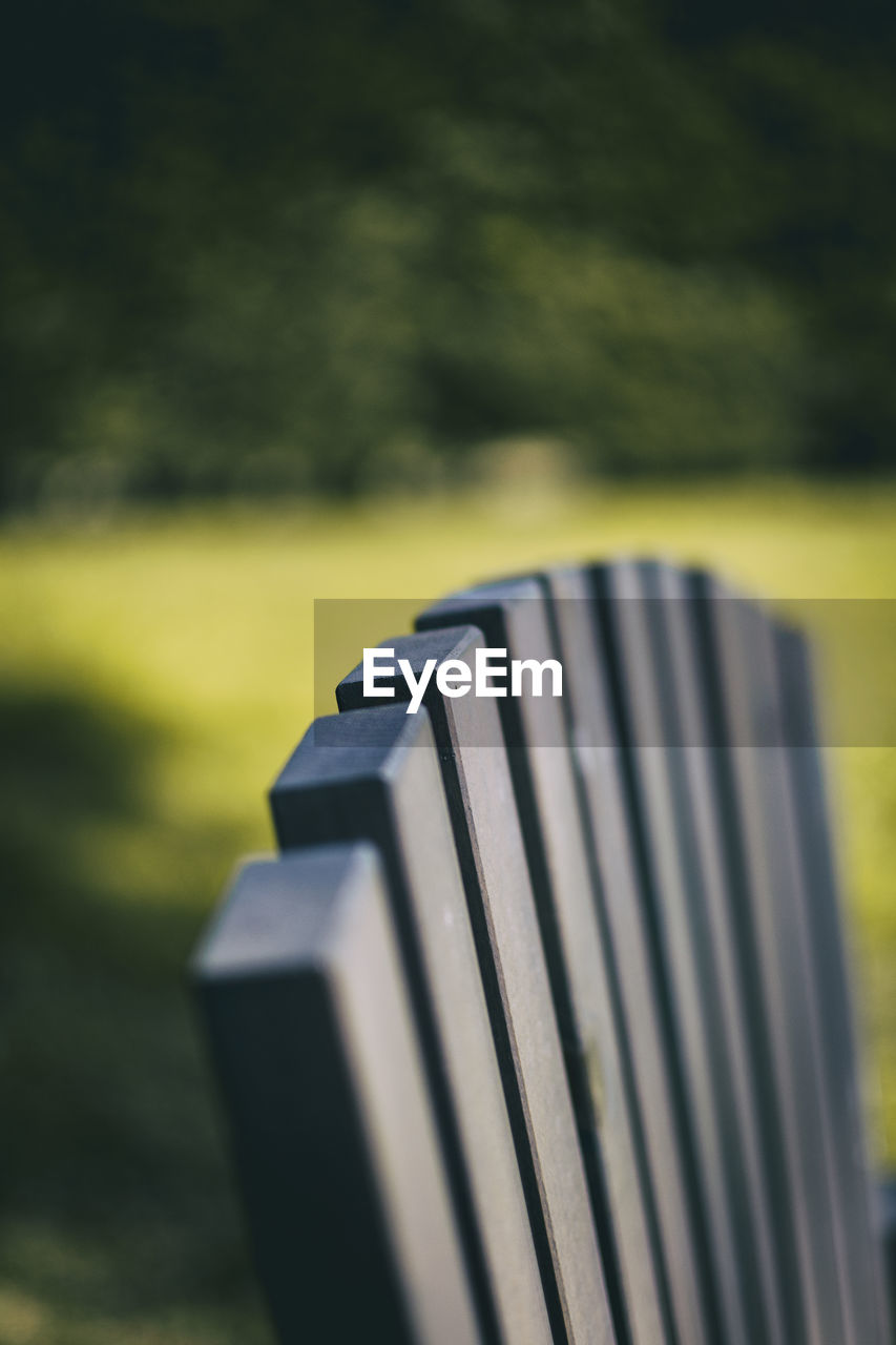 CLOSE-UP OF METAL OBJECT ON FIELD