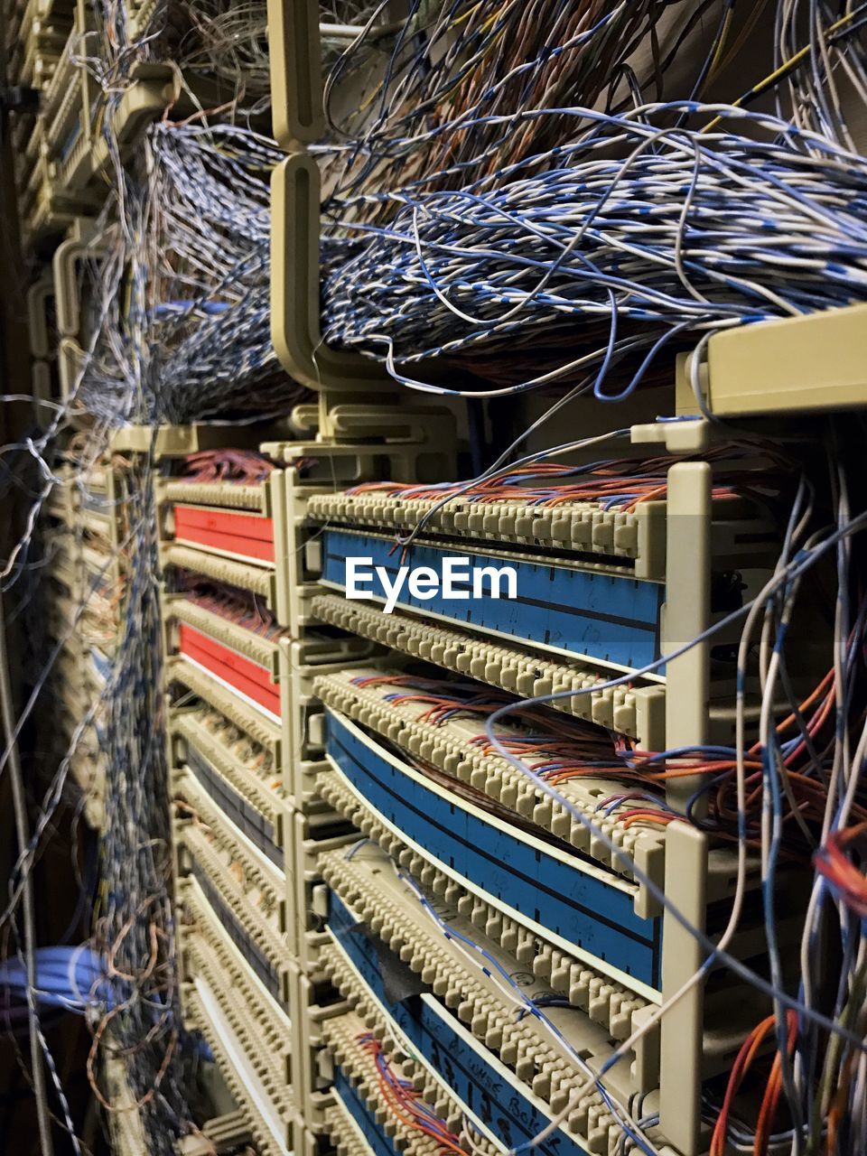 LOW ANGLE VIEW OF COMMUNICATIONS TOWER IN ROOM