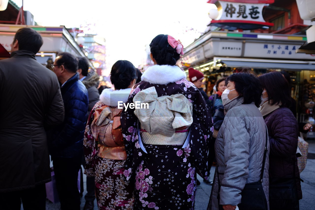 People standing on street in city