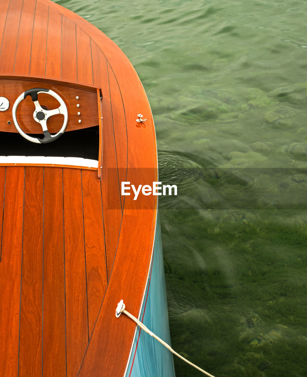 High angle view of orange boat moored in sea