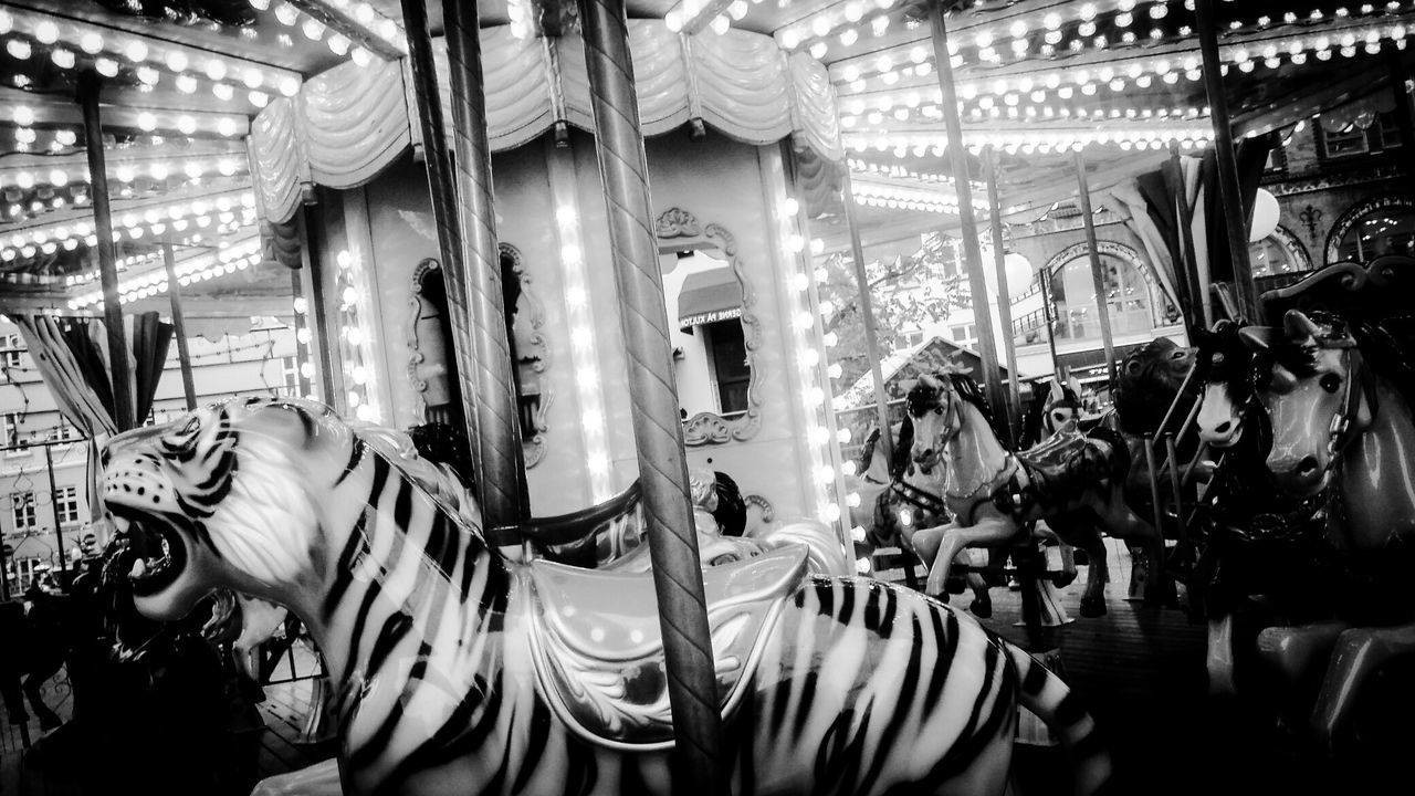 Low angle view of illuminated carousel