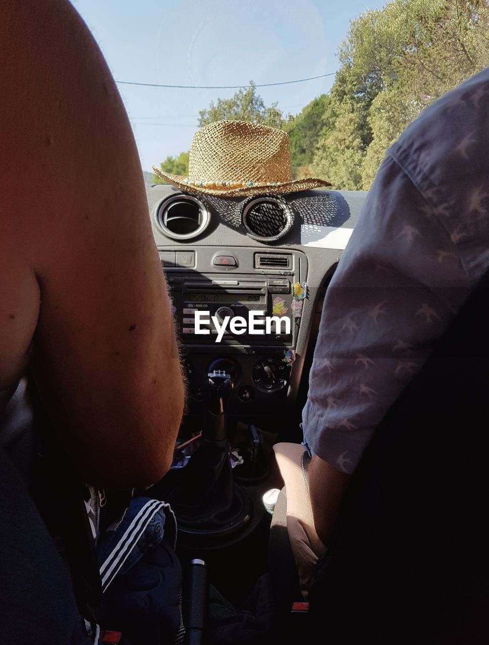 CLOSE-UP OF MAN DRIVING CAR