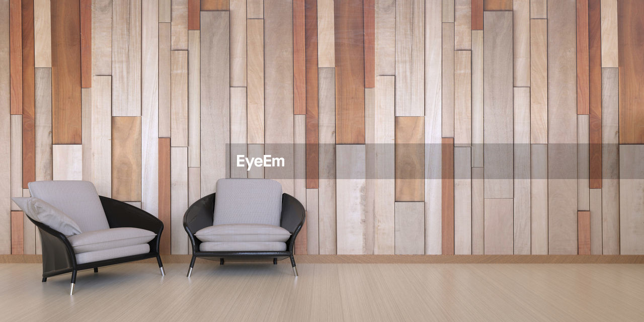 Empty chairs on hardwood floor at home