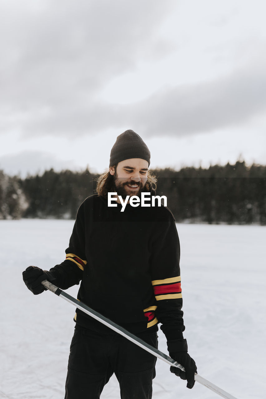 Man standing on frozen lake