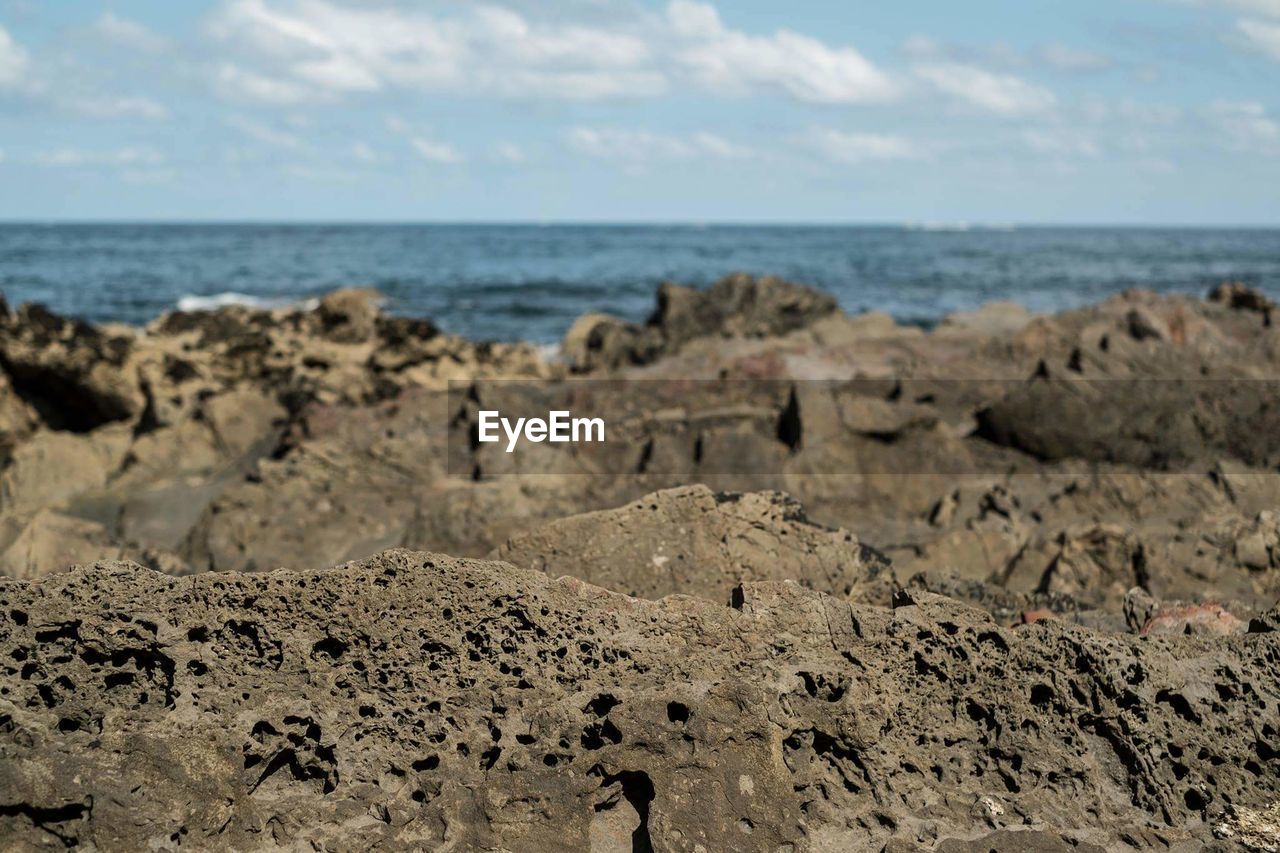 PANORAMIC VIEW OF BEACH AGAINST SKY