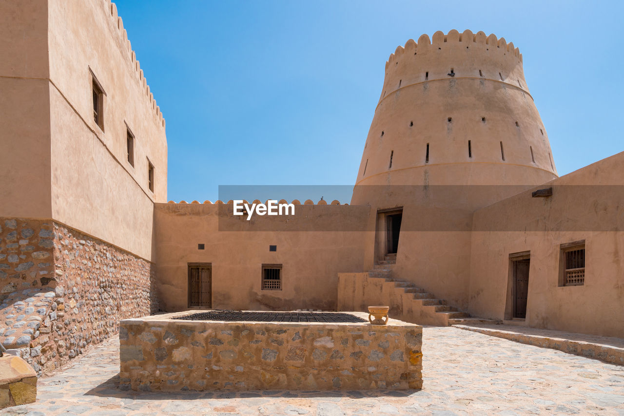 Courtyard of a small medieval arabian fort in bukha, oman.