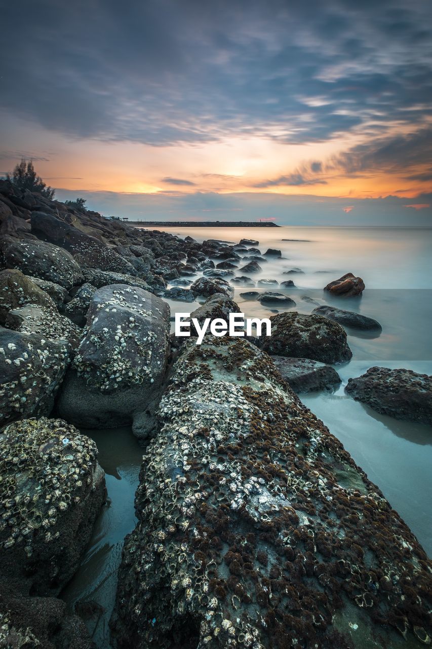 Scenic view of sea against sky during sunset