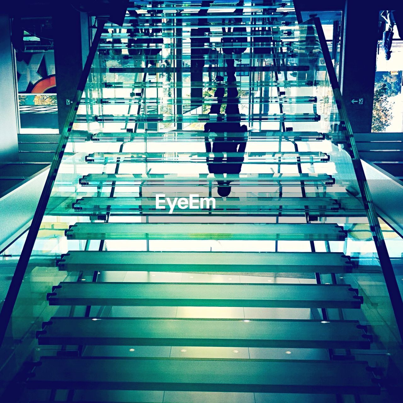 Upside down image of transparent steps in store