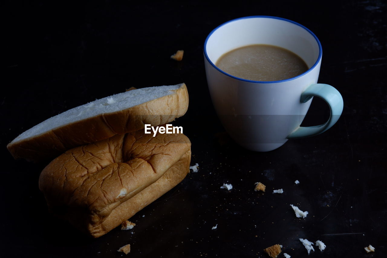 HIGH ANGLE VIEW OF COFFEE CUP AND TEA