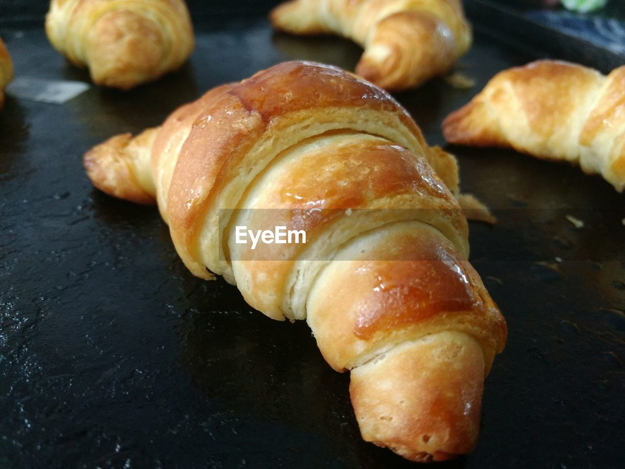 Close-up of croissants in baking sheet