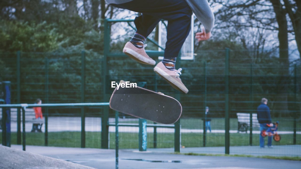 Low section of man skating at park