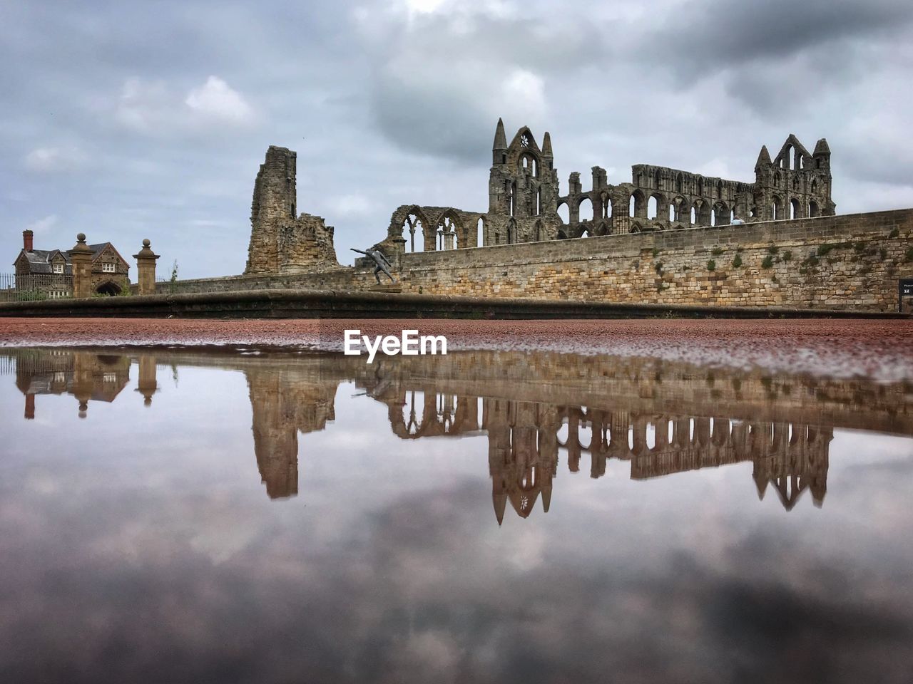 REFLECTION OF BUILDING IN LAKE