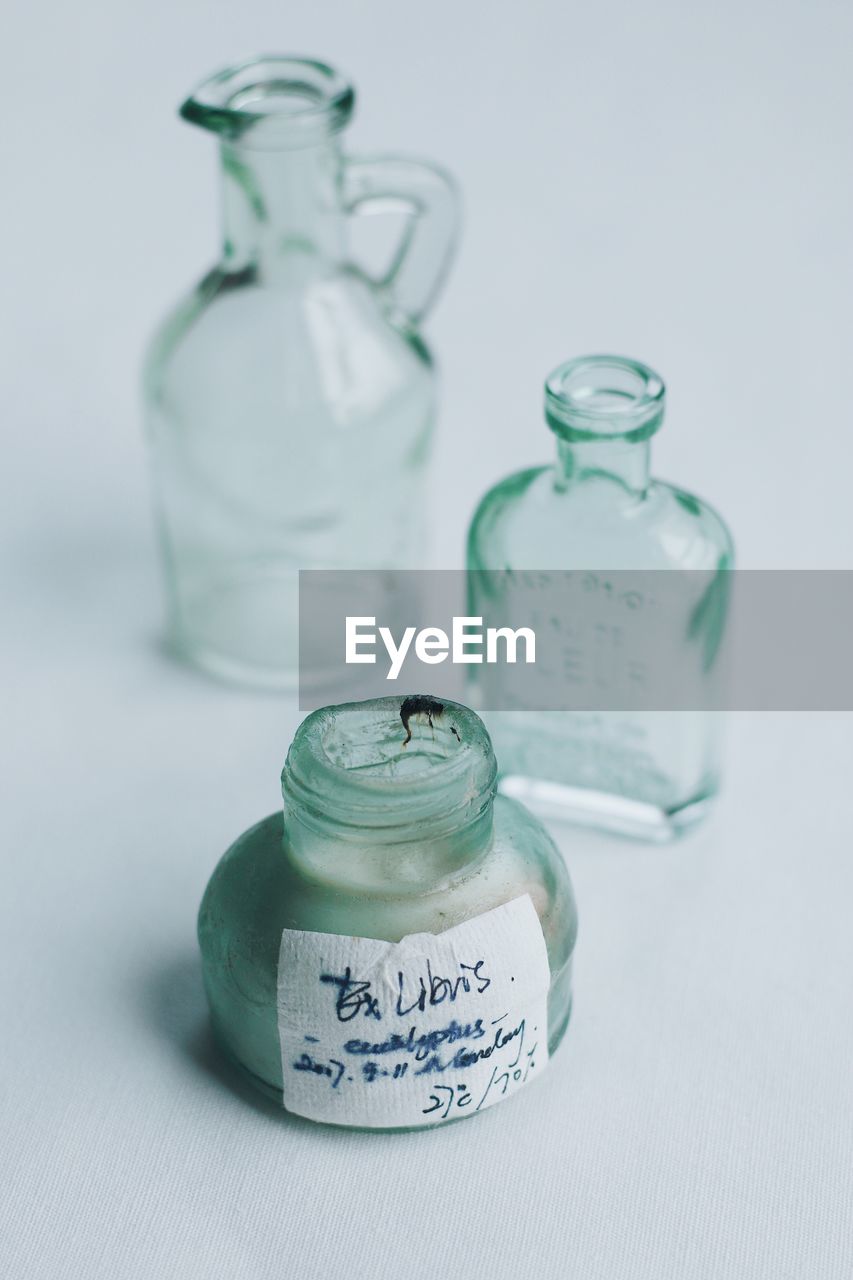 CLOSE-UP OF GLASSES ON TABLE