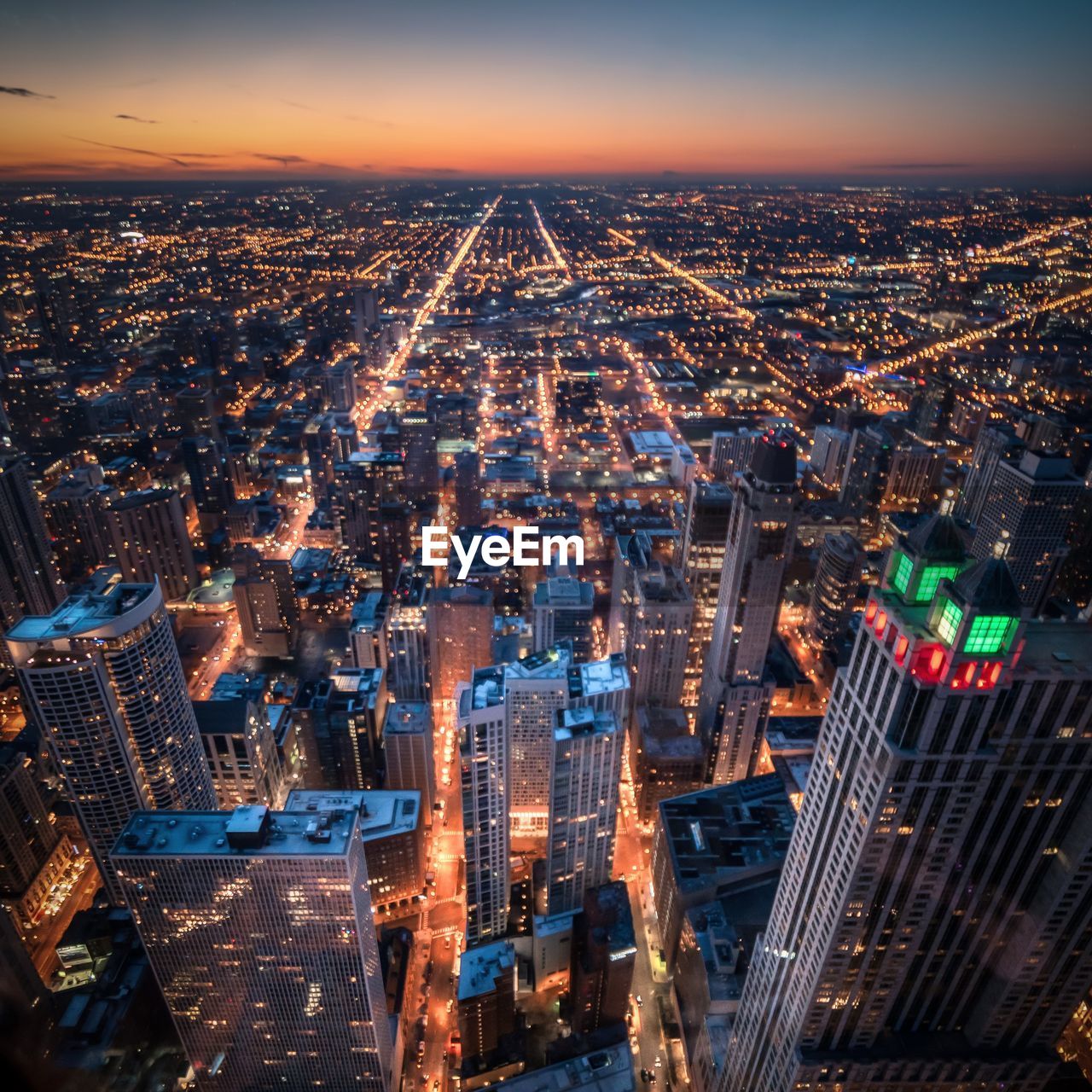 High angle view of illuminated buildings in city