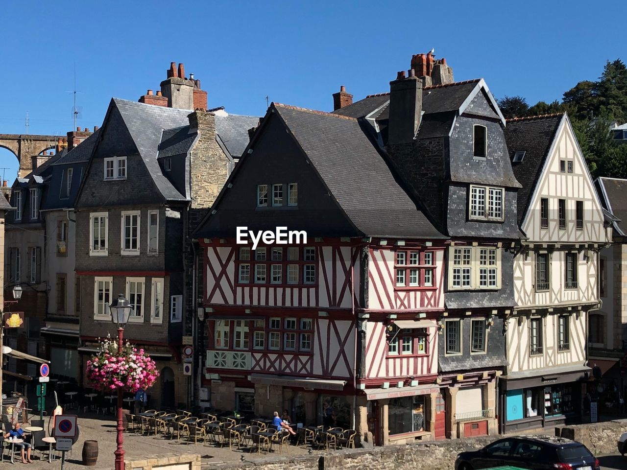 Buildings in town against clear sky